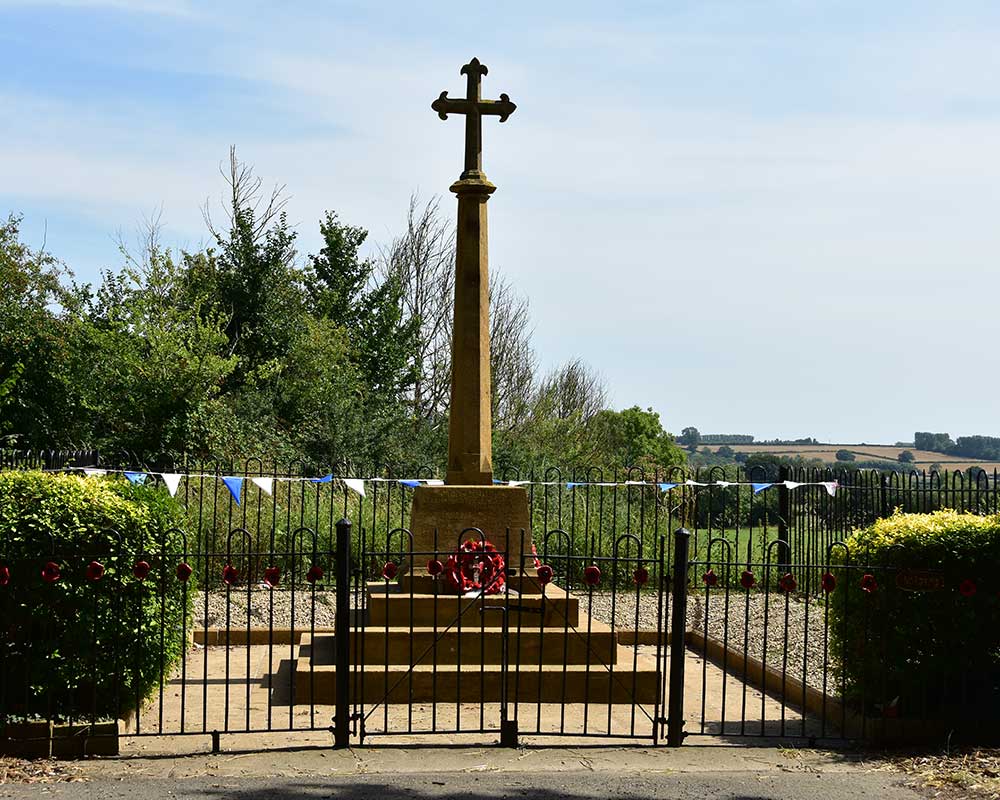 The memorial in Hambridge village with poppy wreath displays